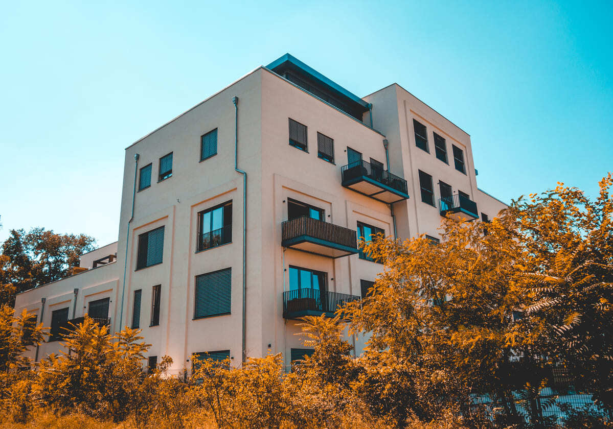Exterior of modern apartment building and sky.